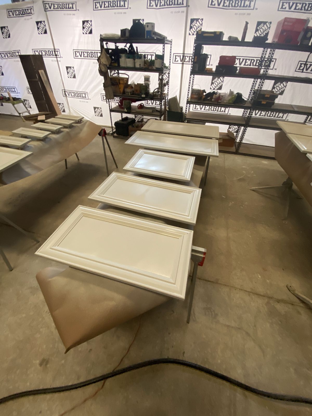 Kitchen cabinet doors laid out in the Coluna spray booth for refinishing