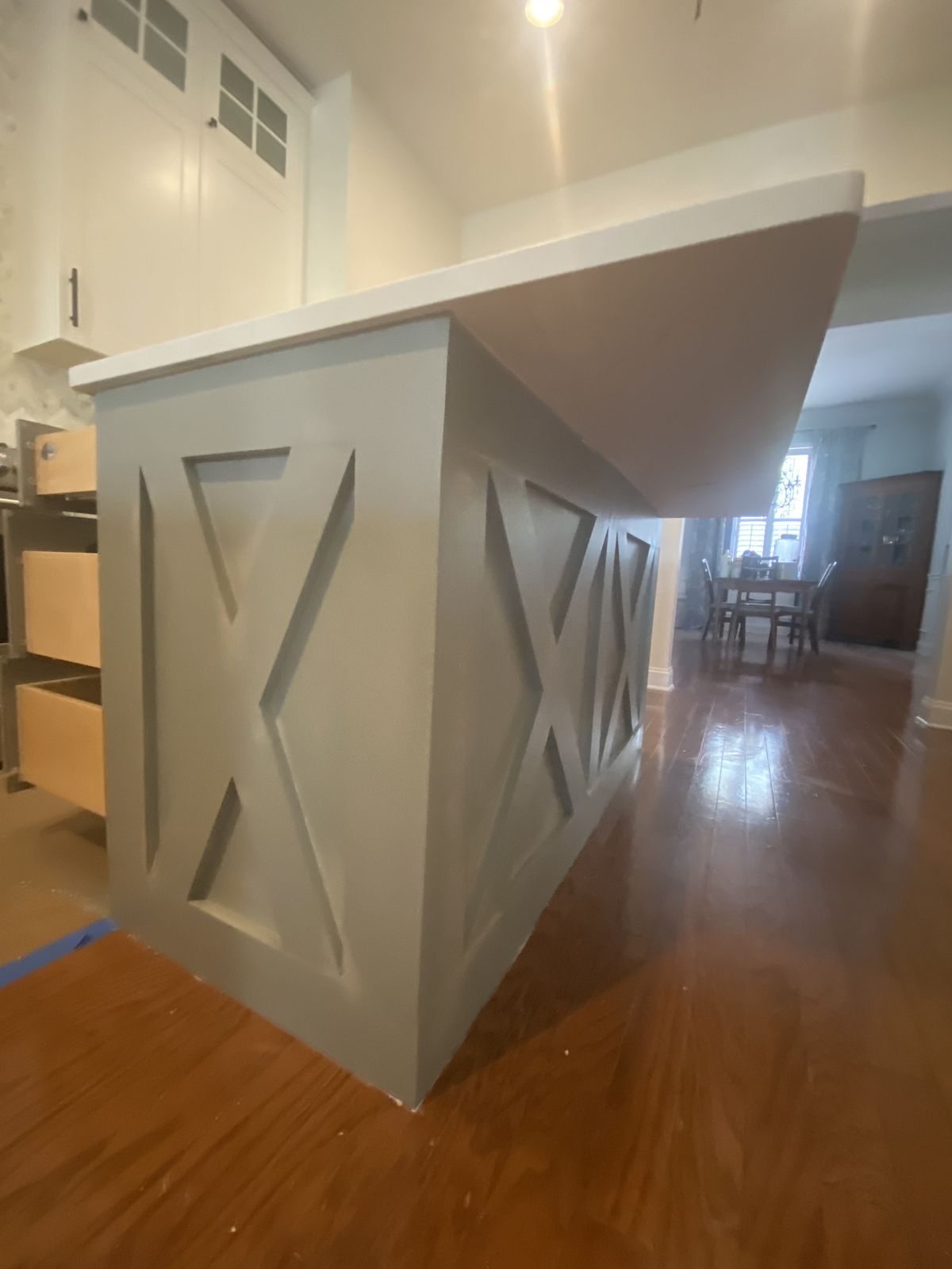 Kitchen island end panel with X barn-door detail
