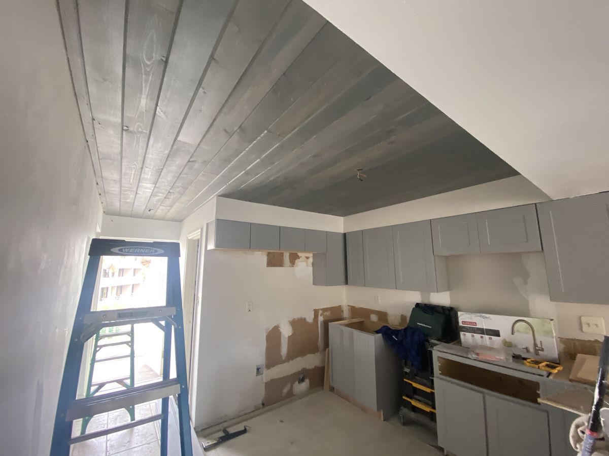 Wood plank ceiling over a kitchen